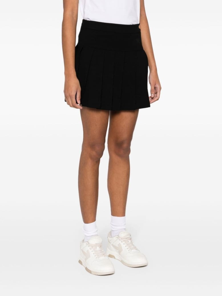 monogram pleated skirt by Selfnex