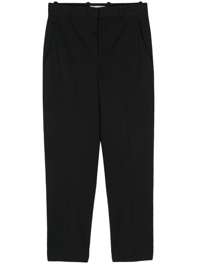 oxford carrot fit trousers by Selfnex