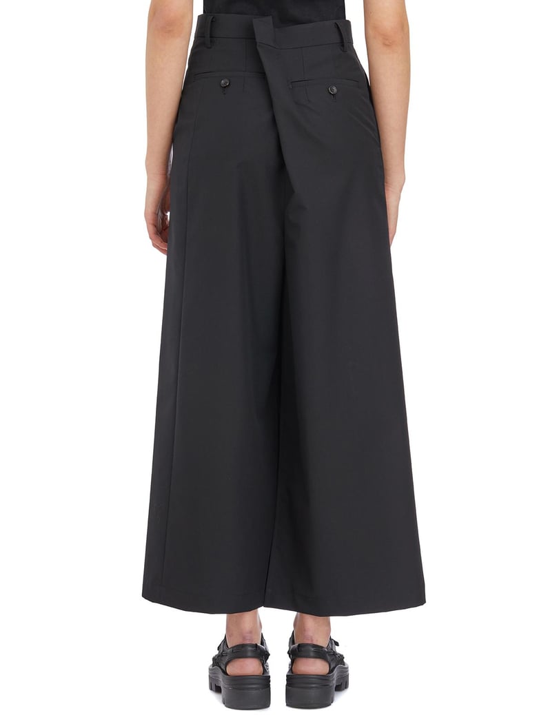 wool asymmetric trousers by Selfnex