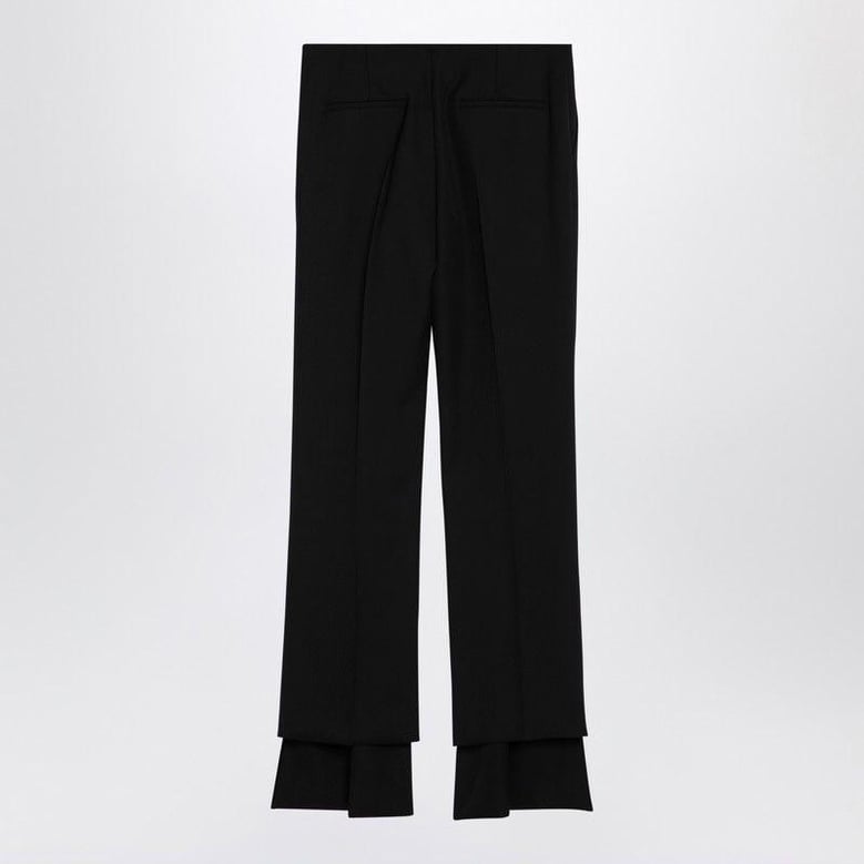 black asymmetrical wool trousers by Selfnex