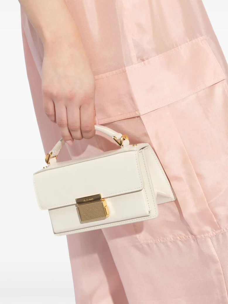 women white leather bag by Selfnex