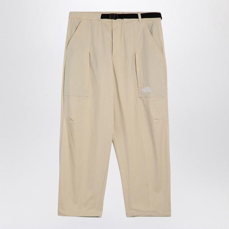 cream cotton-blend trousers by Selfnex