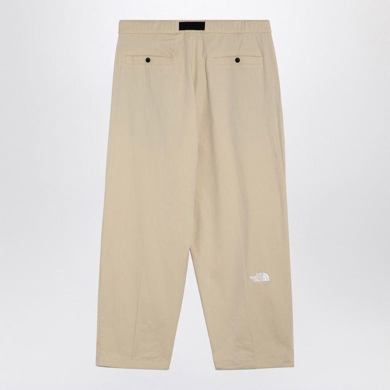 cream cotton-blend trousers by Selfnex