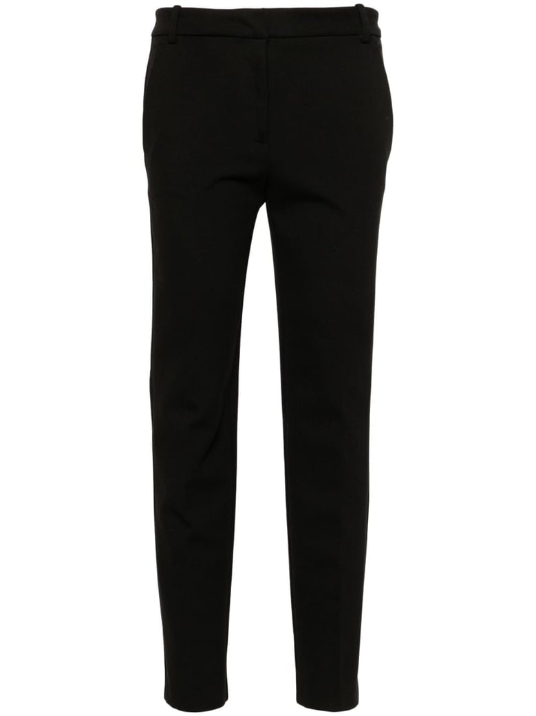 black milano-knit slim trousers by Selfnex