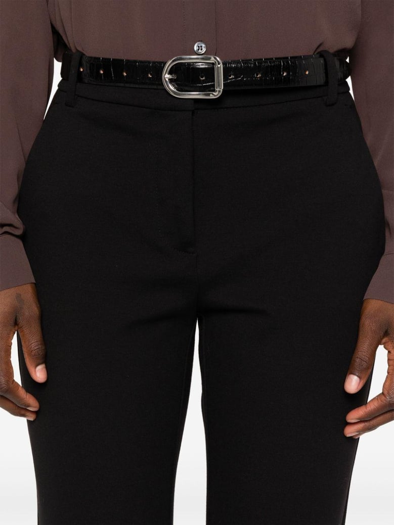 black milano-knit slim trousers by Selfnex