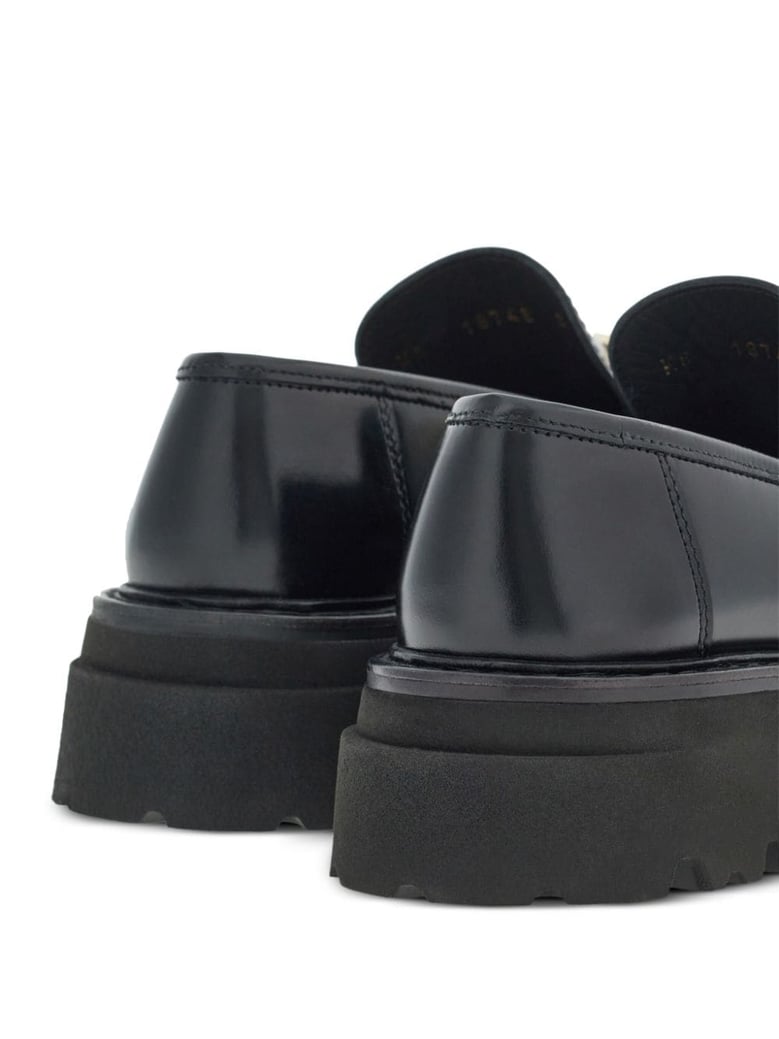 gancini-buckle black leather loafers by Selfnex