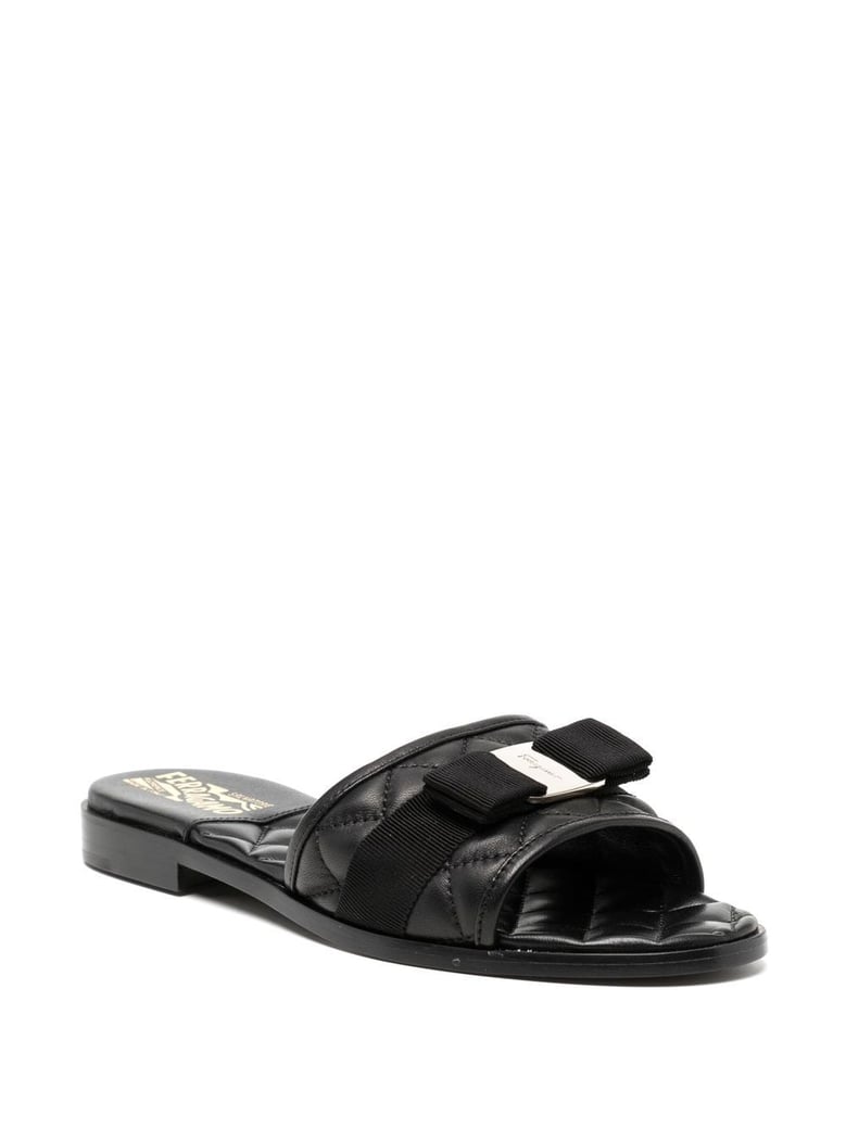 black leather slip-on flats by Selfnex