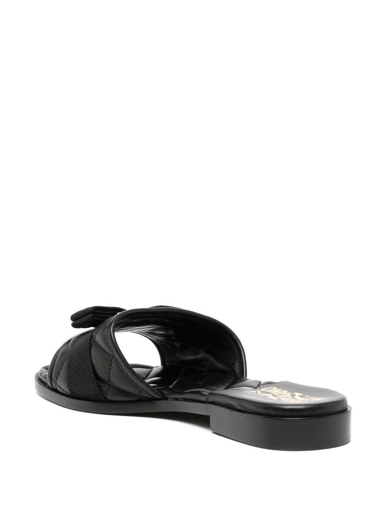 black leather slip-on flats by Selfnex