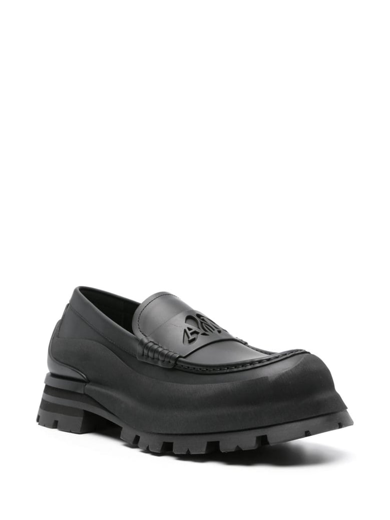matte black leather slip-ons by Selfnex