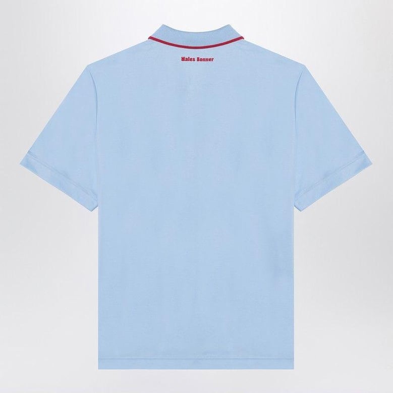 light blue polo shirt with logo by Selfnex