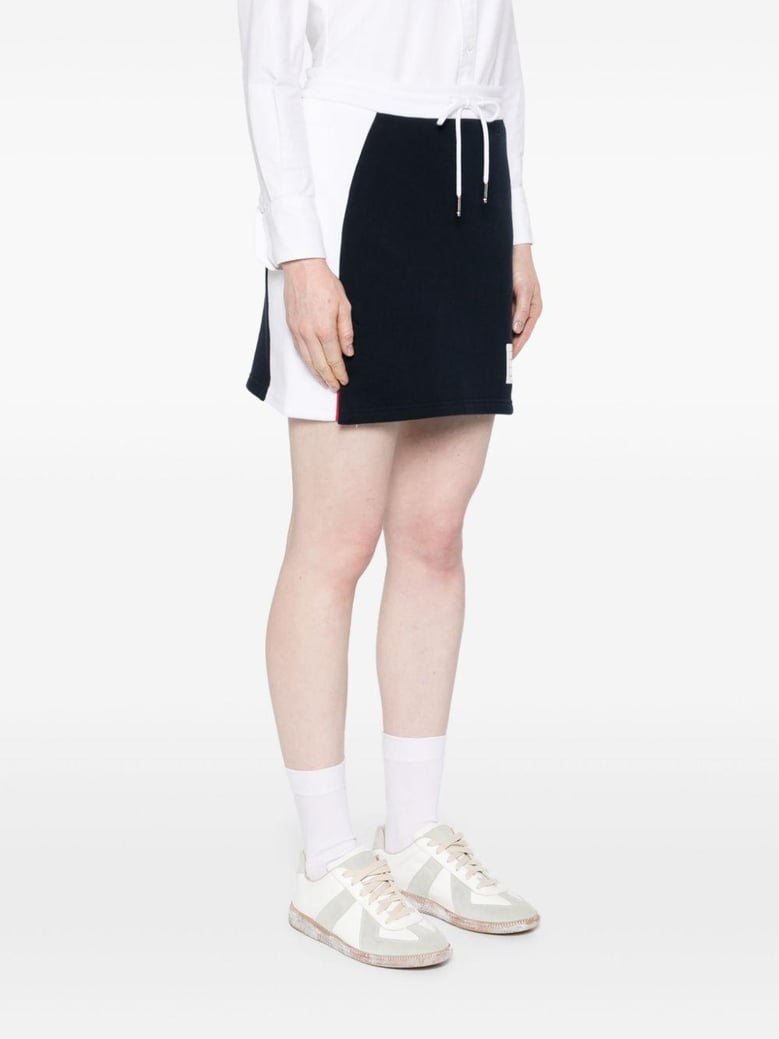 mini skirt w/ engineered 4 bar in blocked classic solid classic loopback jersey by Selfnex