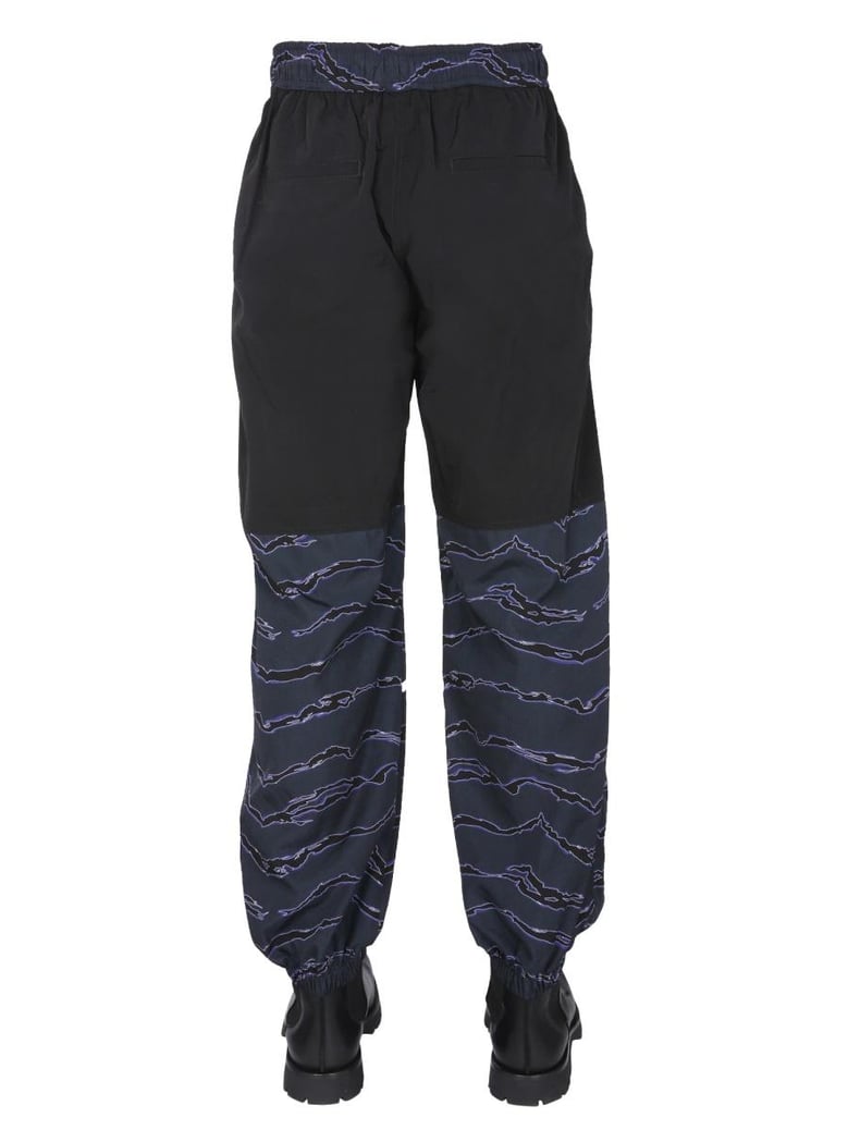 jogging pants with camou print by Selfnex