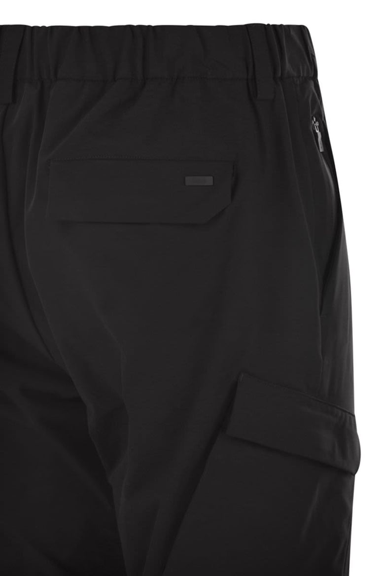 cargo trousers with mechanical stretch yarn by Selfnex