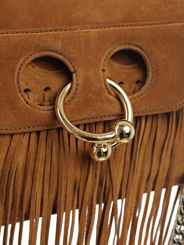 mini pierce leather fringe by Selfnex