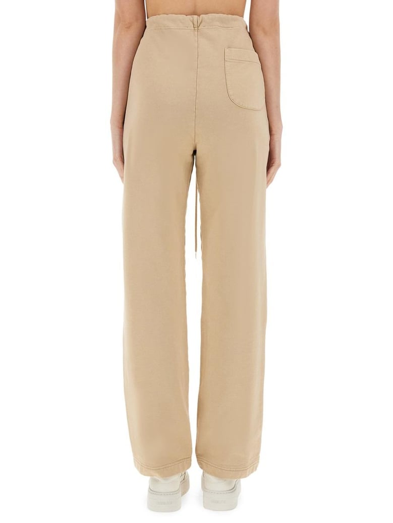 beige cotton trousers by Selfnex
