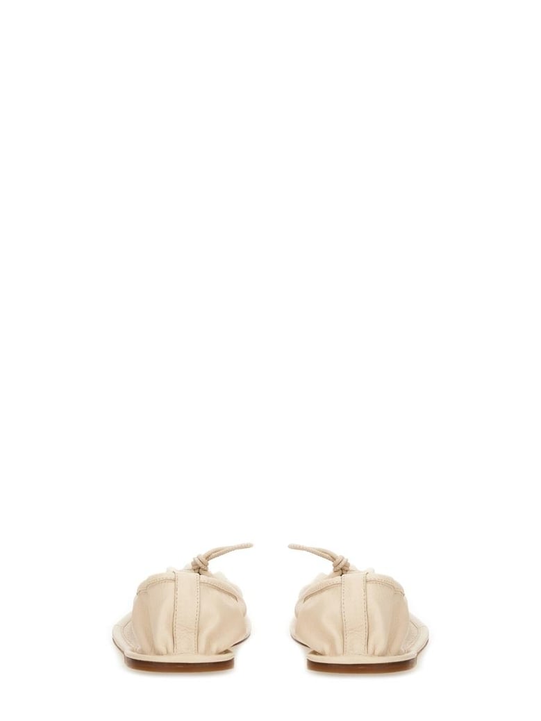 beige leather flats by Selfnex