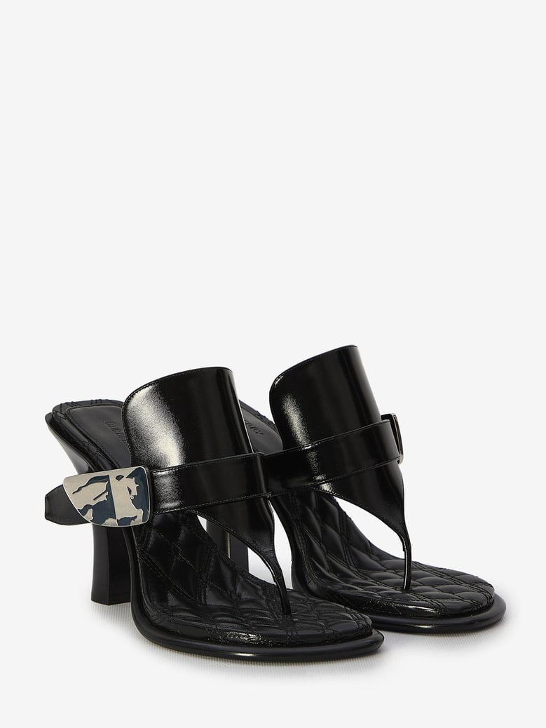 black leather bay thong mules by Selfnex