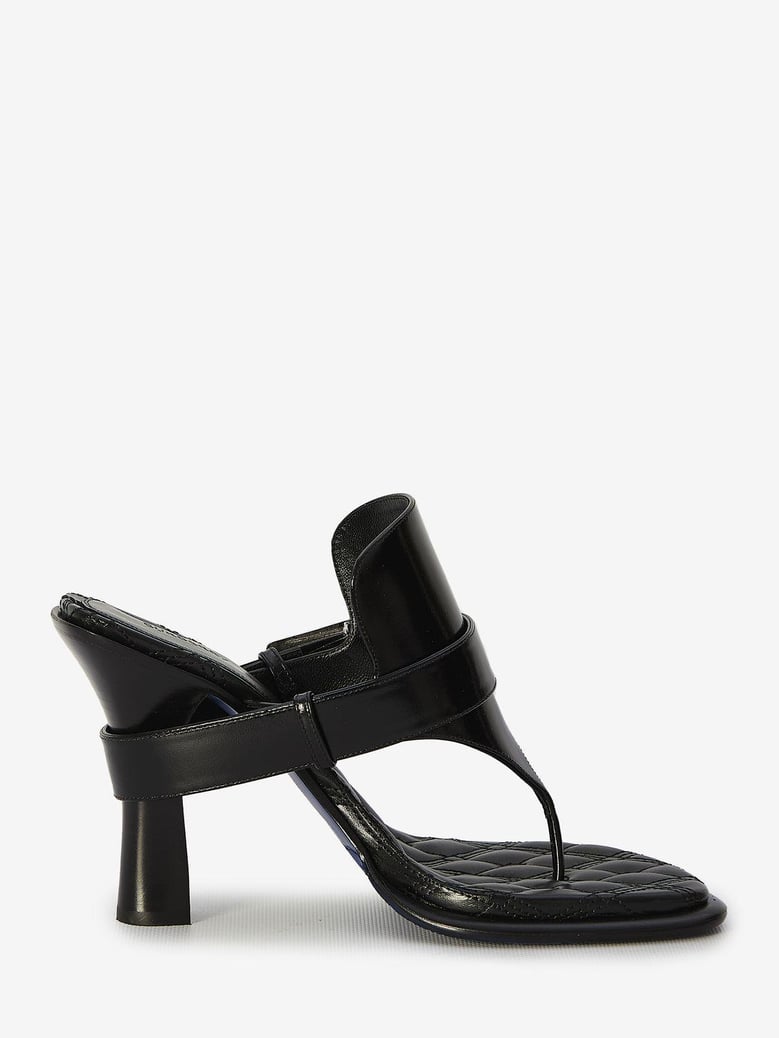 black leather bay thong mules by Selfnex