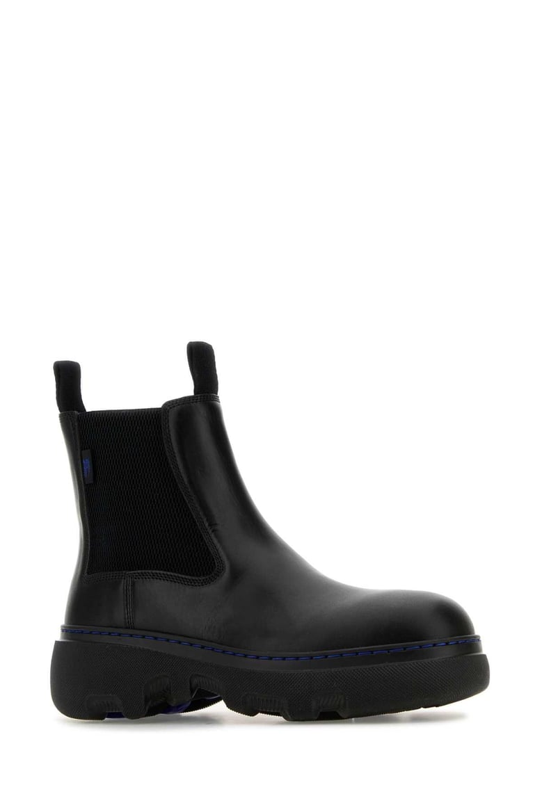 black leather ankle boots by Selfnex