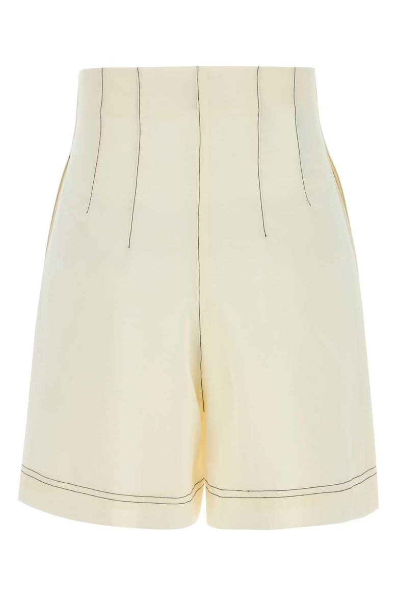 ivory polyester blend shorts by Selfnex