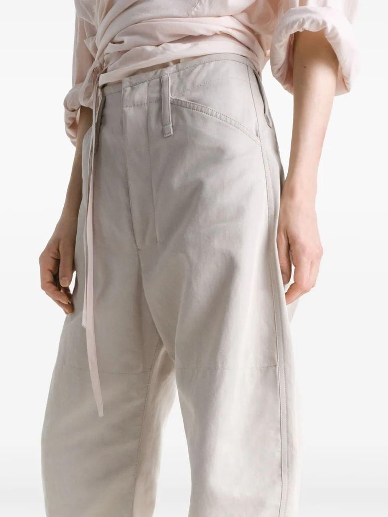 beige tapered pants with camal buttons by Selfnex