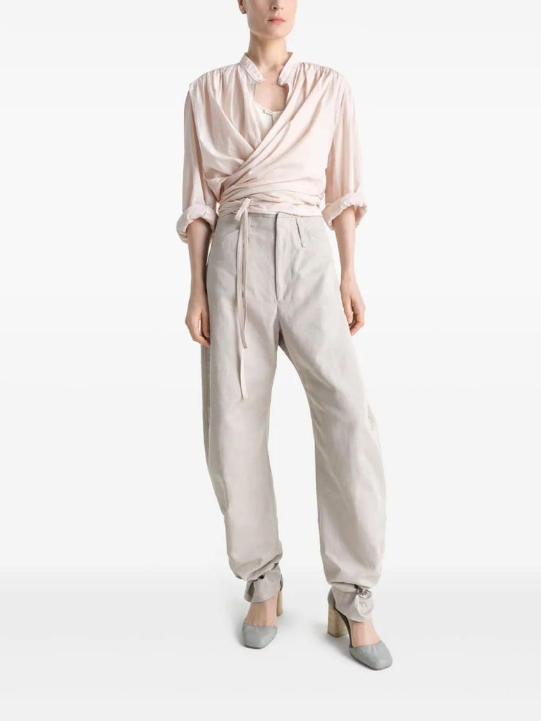 beige tapered pants with camal buttons by Selfnex