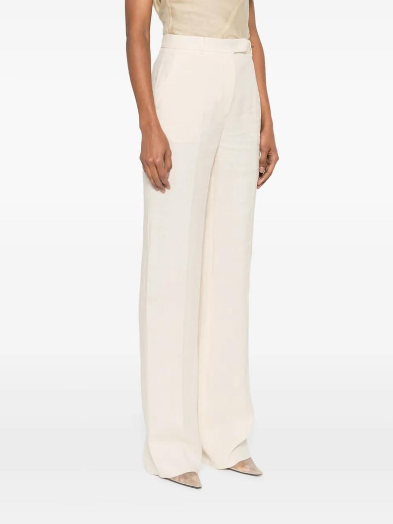 butter linen trousers by Selfnex