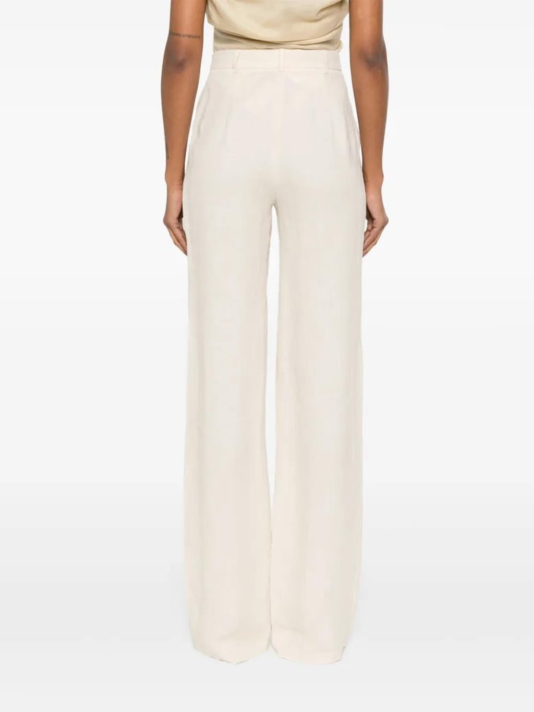 butter linen trousers by Selfnex