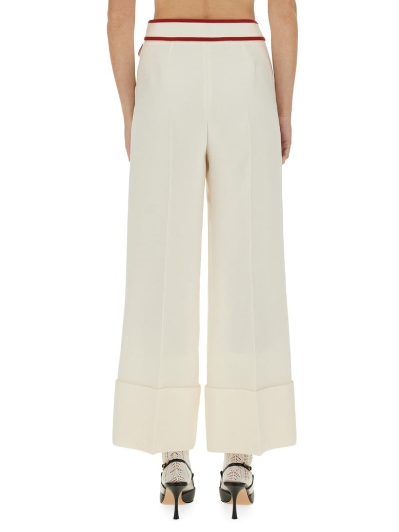 ivory trousers with gold v by Selfnex