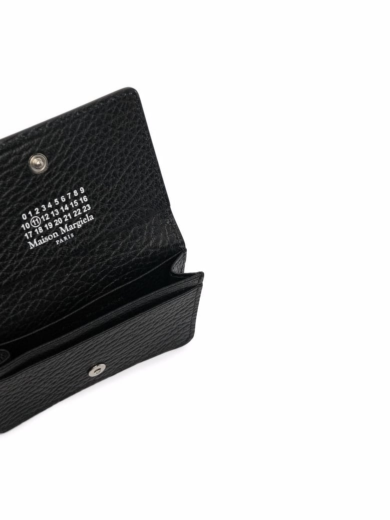 black leather coin purse by Selfnex