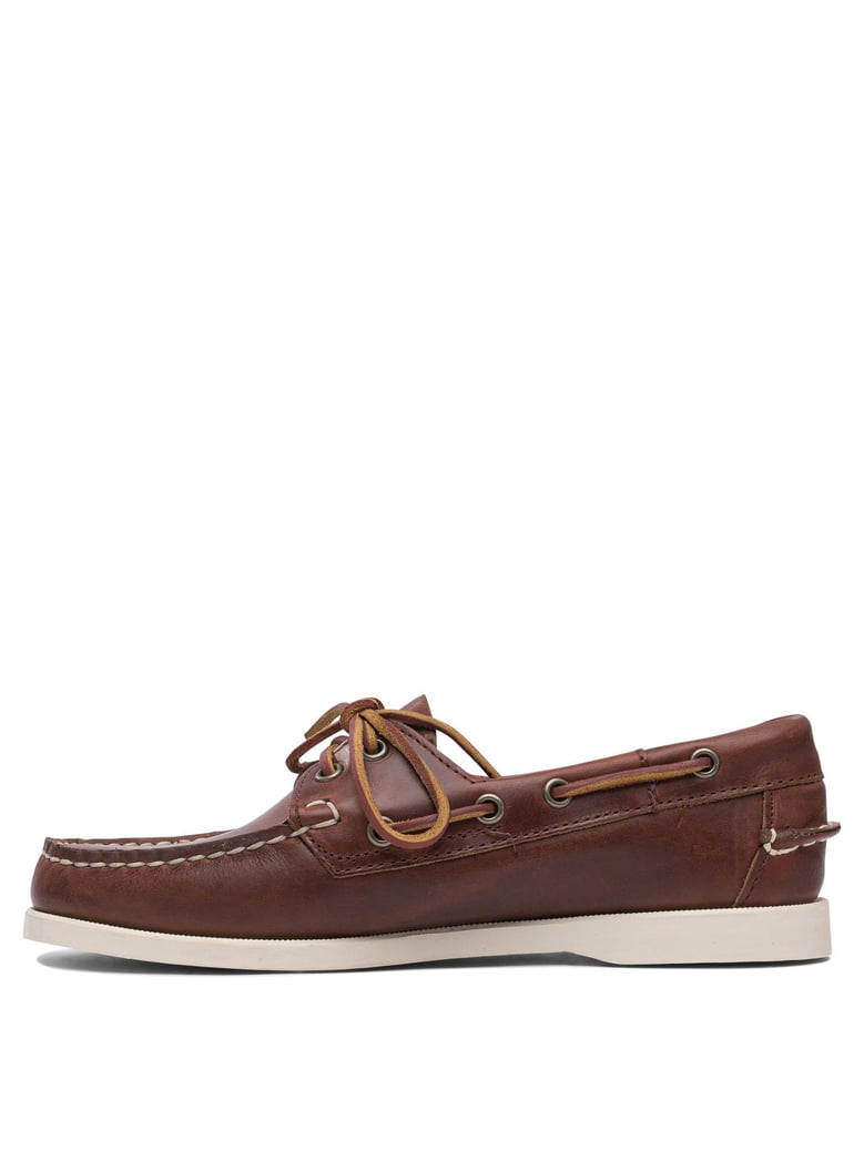 brown rubber loafers by Selfnex