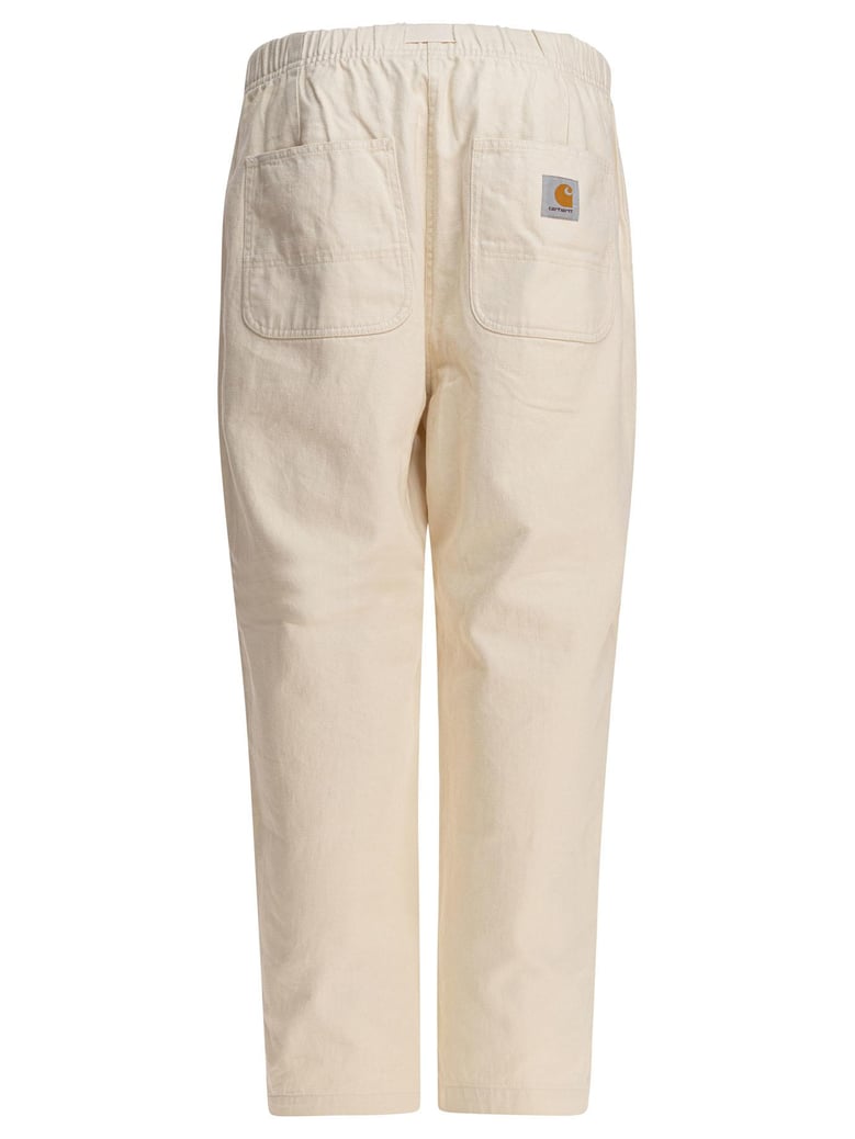 beige cotton trousers by Selfnex