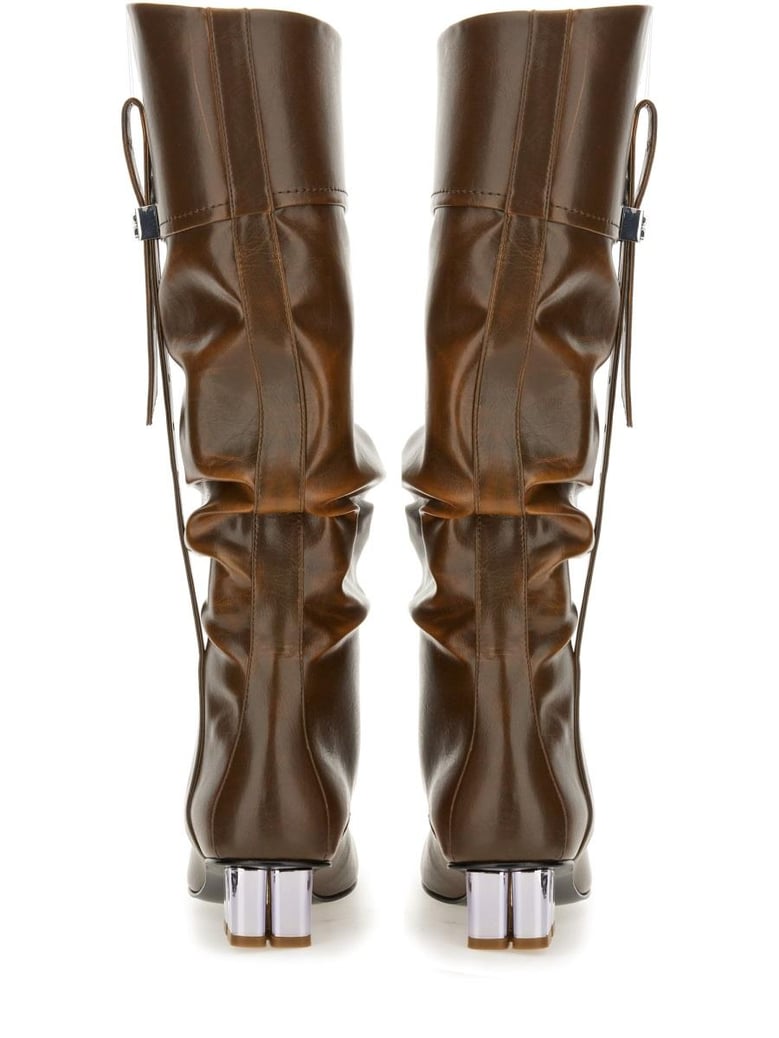 black polyurethane boots by Selfnex