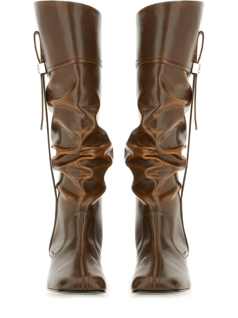 black polyurethane boots by Selfnex