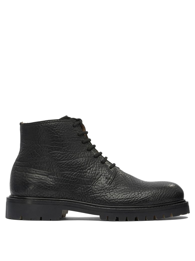 black rubber ankle boots by Selfnex