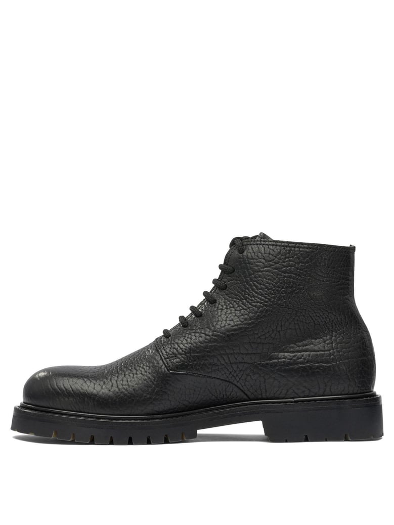 black rubber ankle boots by Selfnex