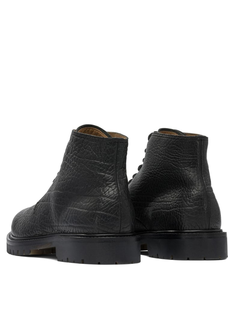 black rubber ankle boots by Selfnex