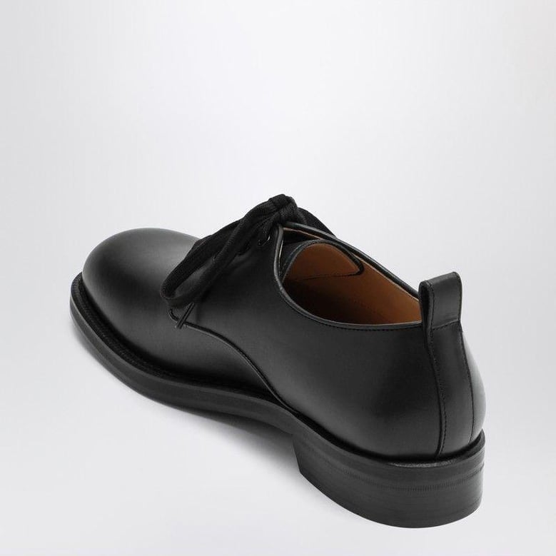black leather strap with vlogo plaque by Selfnex