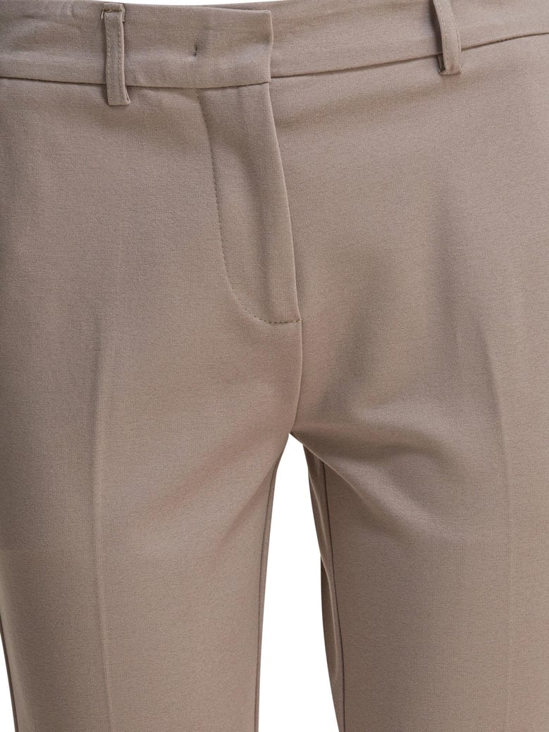 beige elastane trousers by Selfnex