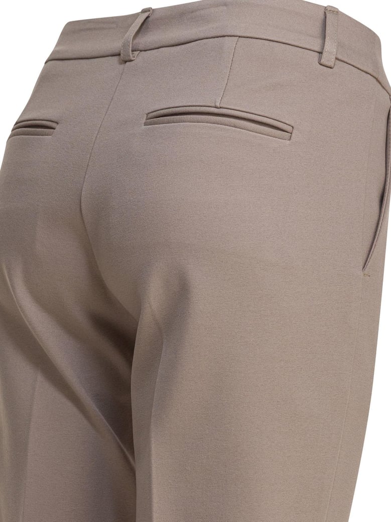 beige elastane trousers by Selfnex