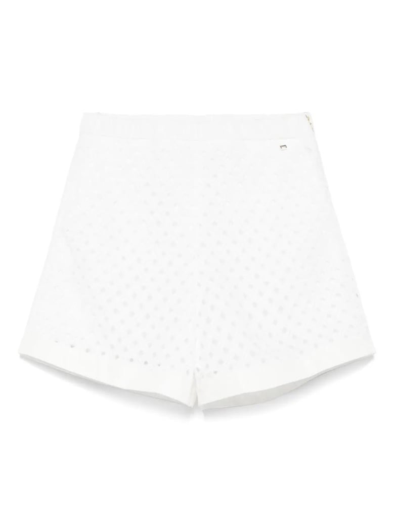 perforated shorts with geometric shapes by Selfnex