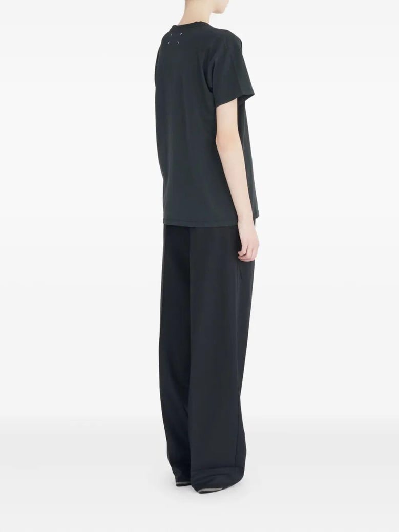 maison margiela blingo short-sleeved black cotton t-shirt graphic on the front four-stitch detail on the back by Selfnex