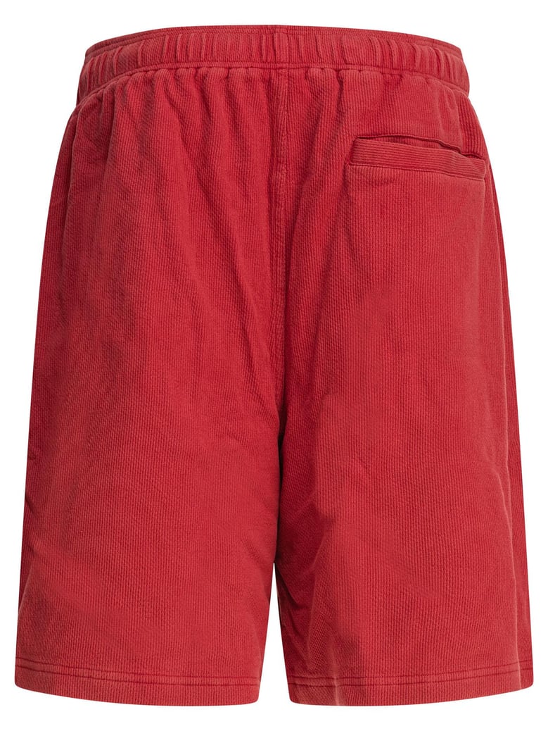 red polyester shorts by Selfnex