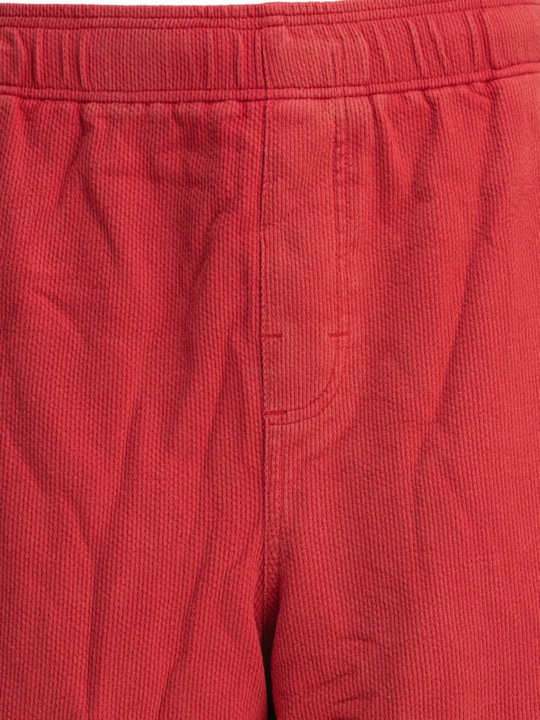 red polyester shorts by Selfnex