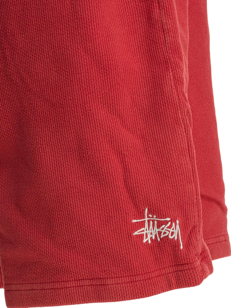 red polyester shorts by Selfnex