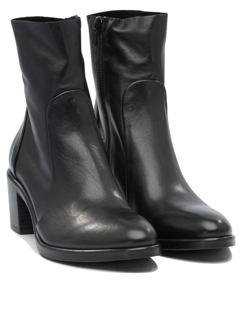 black rubber ankle boots by Selfnex
