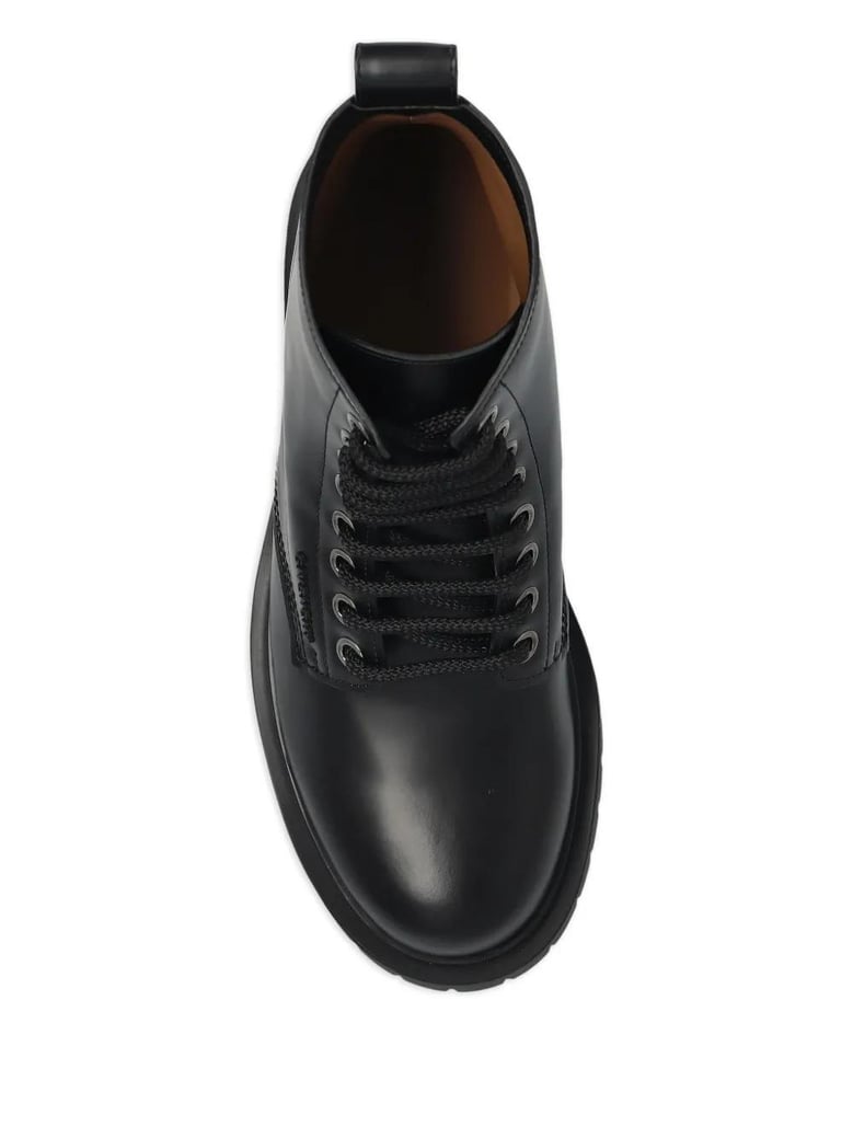 black leather ankle boots by Selfnex