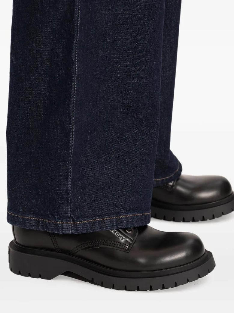 black leather ankle boots by Selfnex