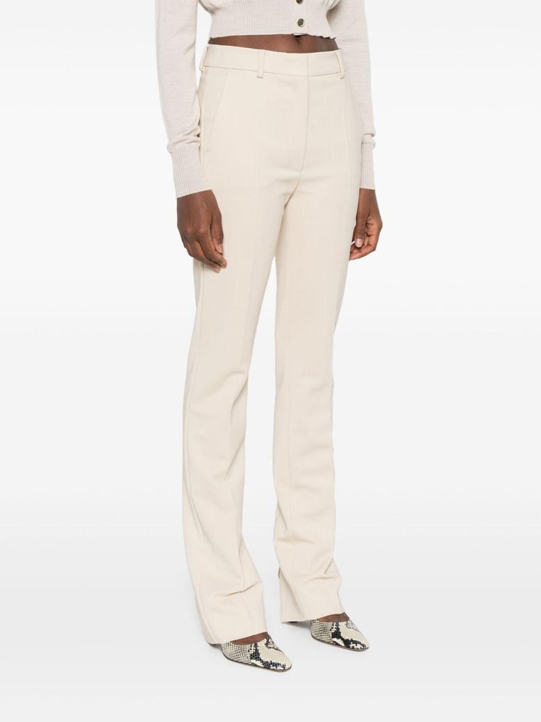 ivory tailored belt loops trousers by Selfnex