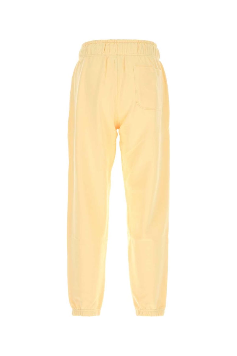pastel yellow cotton joggers by Selfnex